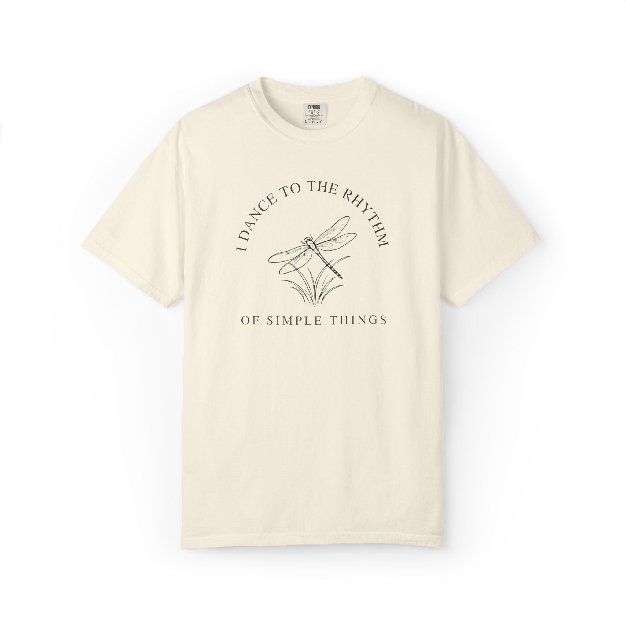 Front view of an ivory Comfort Colors t-shirt featuring the I Dance to the Rhythm of Simple Things dragonfly design