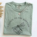 Folded Bay Comfort Colors t-shirt with the I Dance to the Rhythm of Simple Things dragonfly design