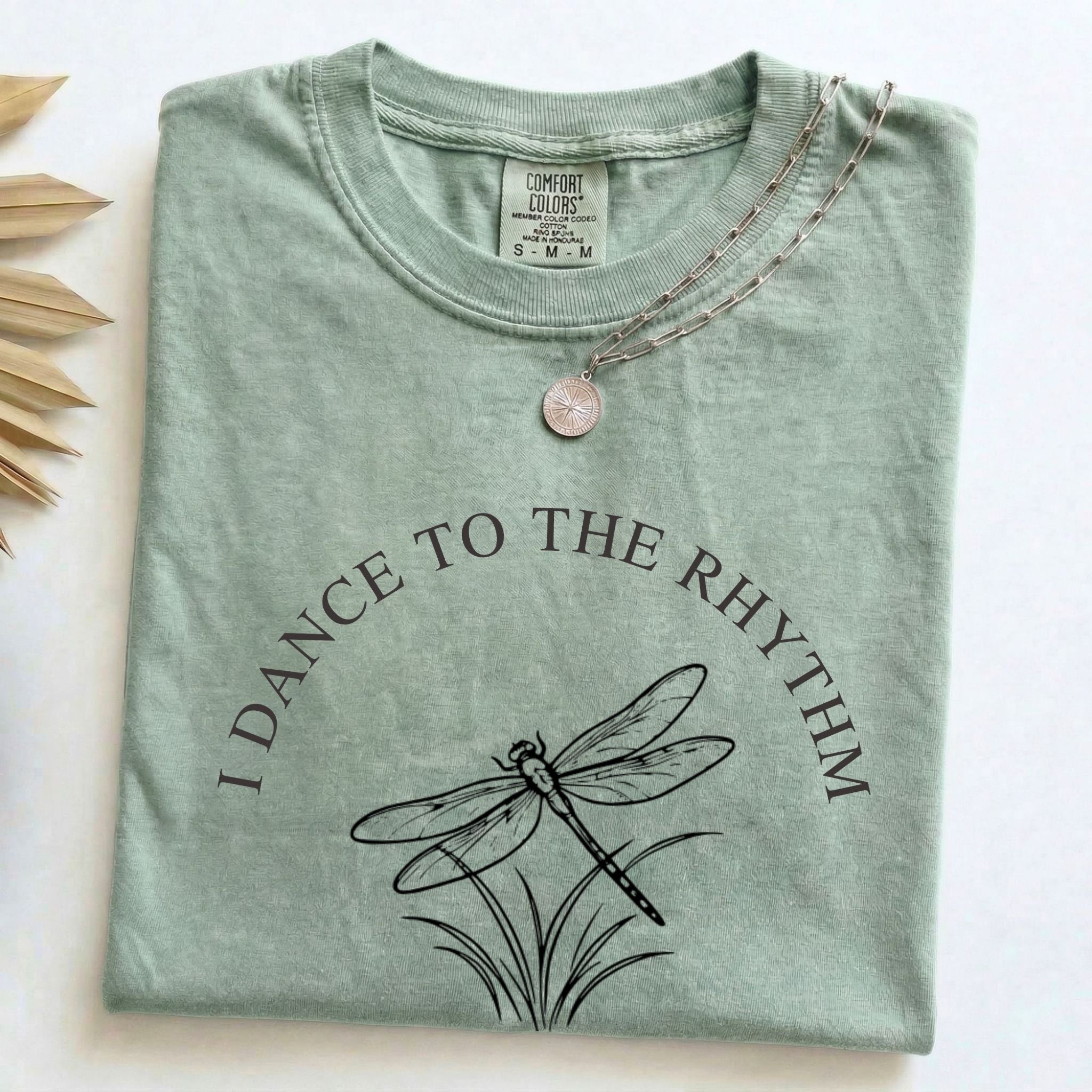 Folded Bay Comfort Colors t-shirt with the I Dance to the Rhythm of Simple Things dragonfly design
