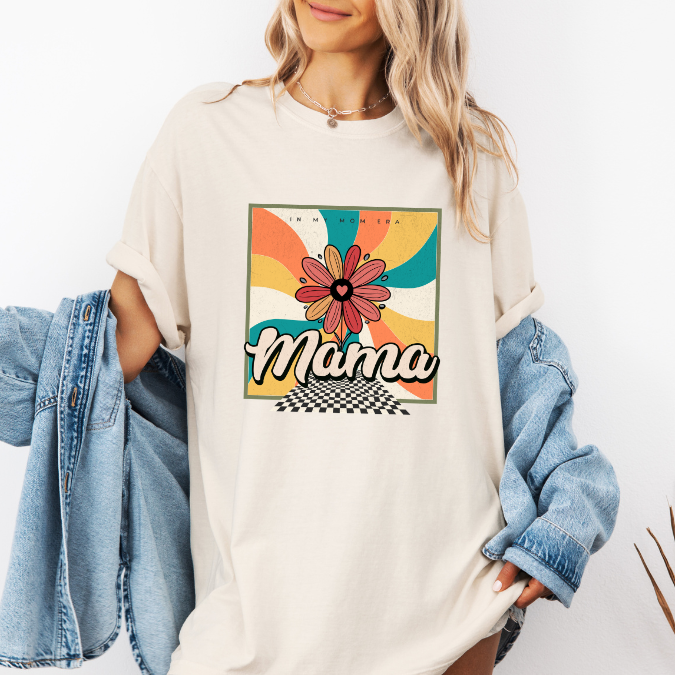 Ivory Comfort Colors graphic tee with a colorful retro floral “In My Mom Era” design and bold mama lettering
