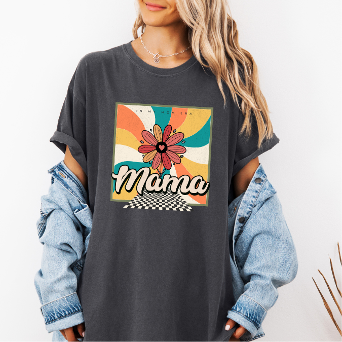 Pepper Comfort Colors graphic tee with a colorful retro floral “In My Mom Era” design and bold mama lettering