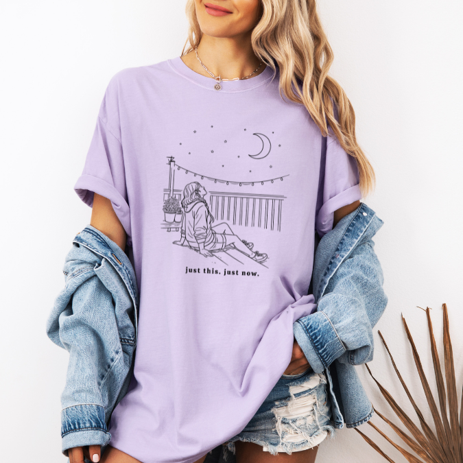 Orchid Comfort Colors graphic tee with a feminine line art illustration of a woman holding a dandelion and the phrase “Make a Wish”