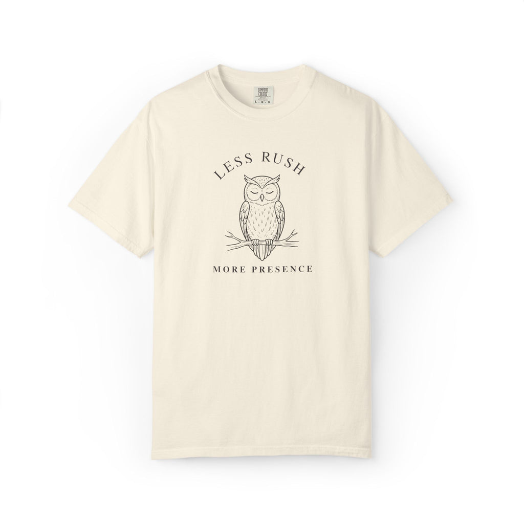 Front view of an ivory Comfort Colors T-shirt with minimalist owl and Less Rush More Presence quote