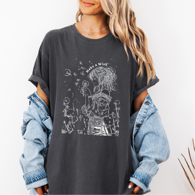 Pepper Comfort Colors graphic tee with a feminine line art illustration of a woman holding a dandelion and the phrase “Make a Wish”
