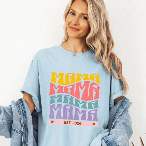 Mama Est. Comfort Colors blue t-shirt with bold retro stacked MAMA typography in yellow pink teal and purple – personalized custom year new mom gift