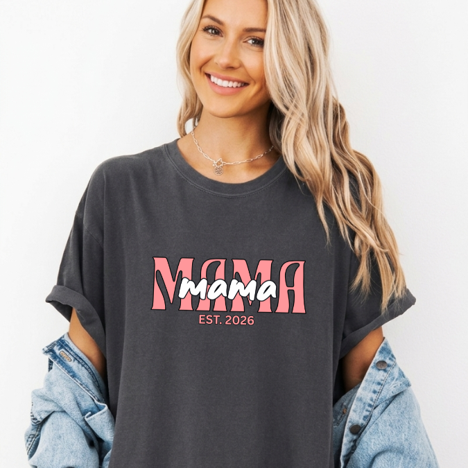 Pepper Comfort Colors t-shirt with layered pink MAMA text and a customizable EST. year design for new moms