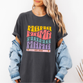 Pepper Comfort Colors t-shirt with bold retro stacked MAMA lettering in yellow, pink, teal, and purple plus a customizable EST. year design for new moms