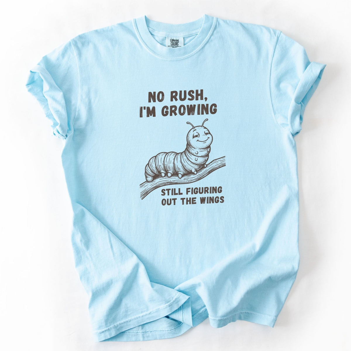 No Rush I'm Growing caterpillar Comfort Colors tee in Chambray blue, flat lay product photo
