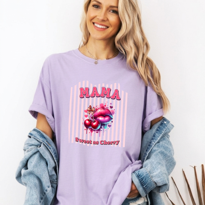Lavender Comfort Colors graphic tee with bold pink MAMA lettering, cherries, lips, and the phrase “Sweet as Cherry.”