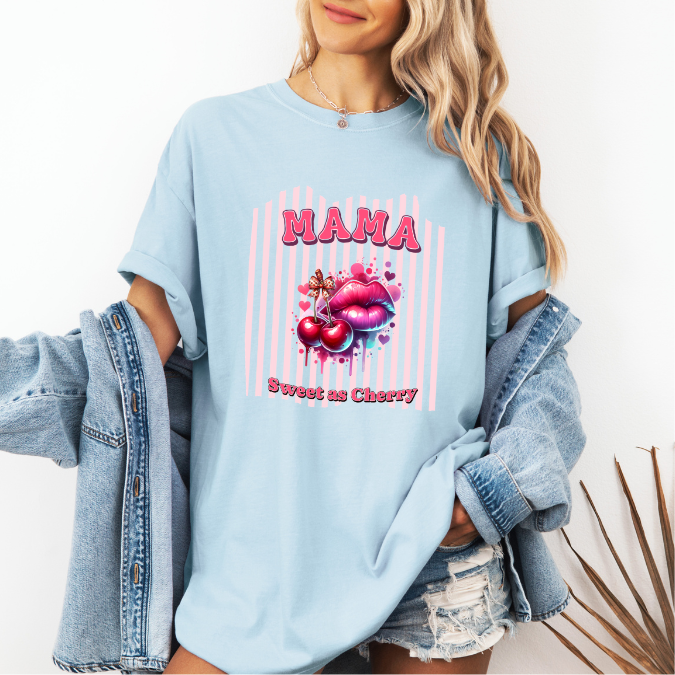 Light Blue Comfort Colors graphic tee with bold pink MAMA lettering, cherries, lips, and the phrase “Sweet as Cherry.”