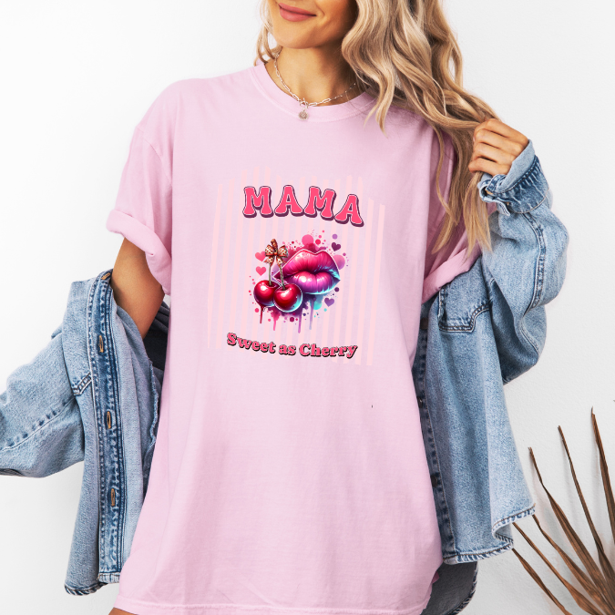 Pink Comfort Colors graphic tee with bold pink MAMA lettering, cherries, lips, and the phrase “Sweet as Cherry.”