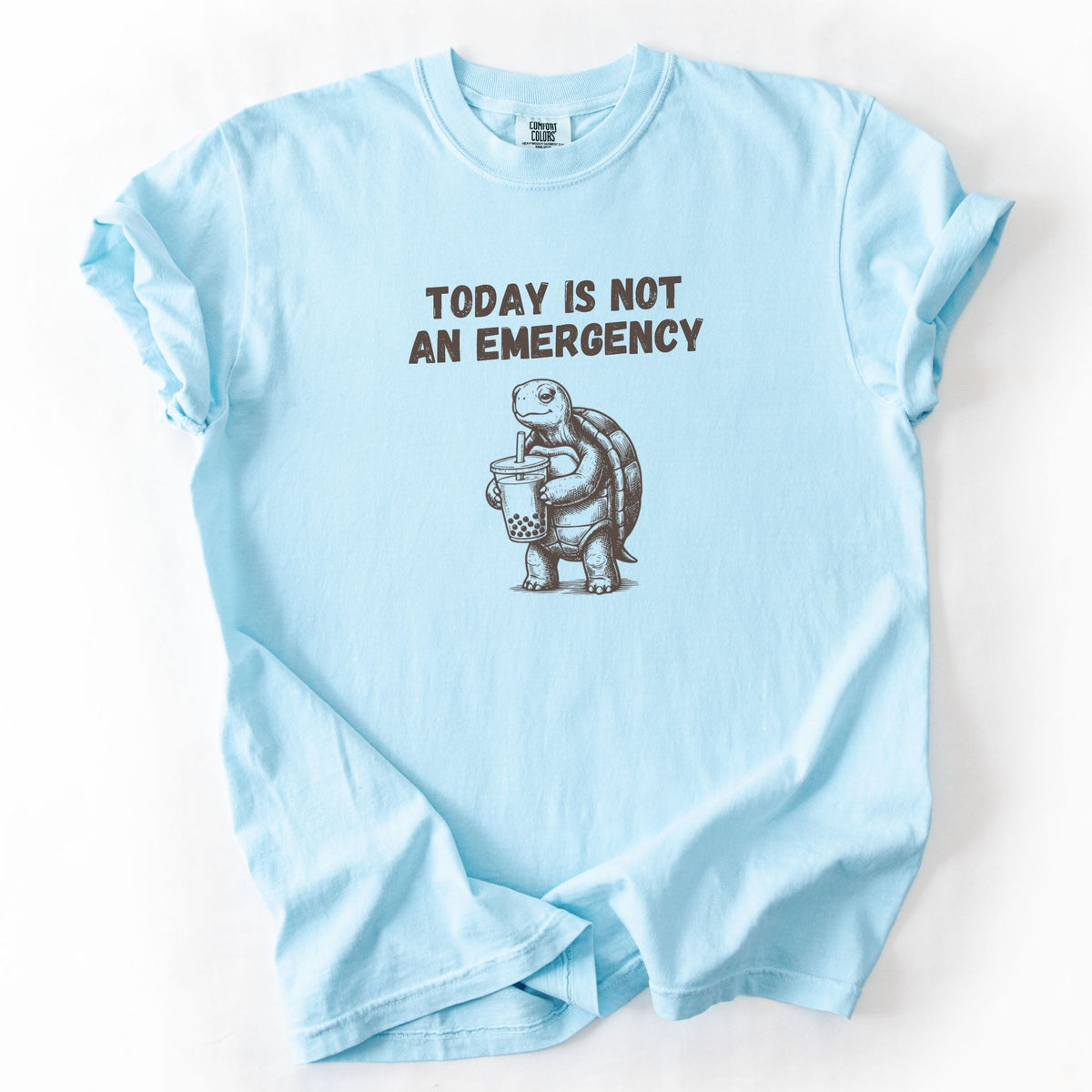 Today Is Not an Emergency turtle Comfort Colors tee in Chambray blue, flat lay product photo