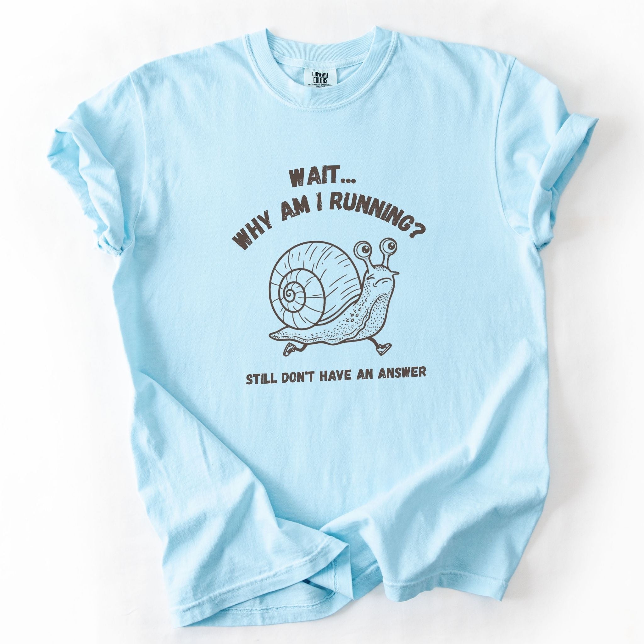 Wait Why Am I Running snail Comfort Colors tee in Chambray blue, flat lay product photo